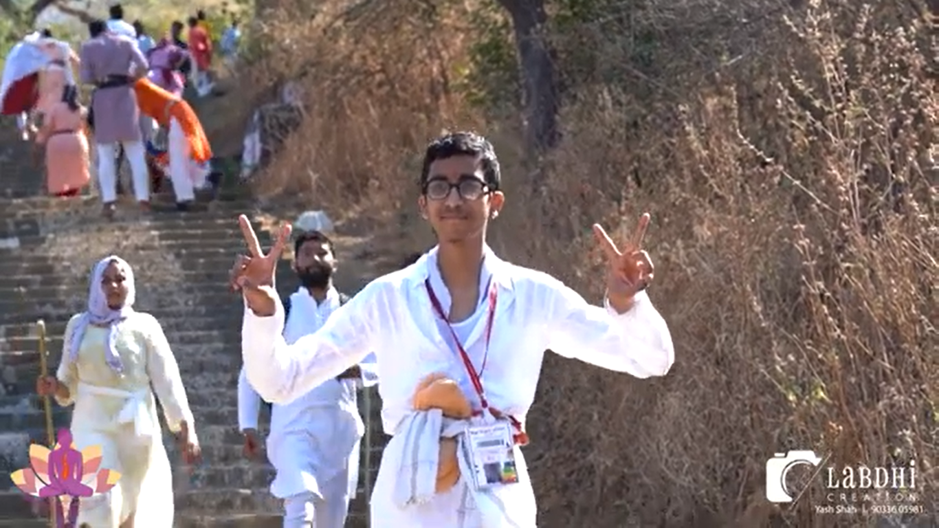A young pilgrim celebrating during the ascent of Shatrunjay Giriraj